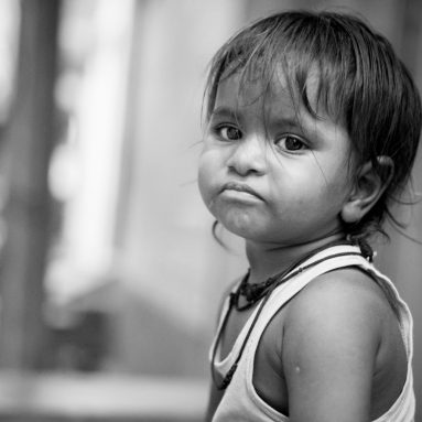 grayscale-photo-of-child-frowning-1339417